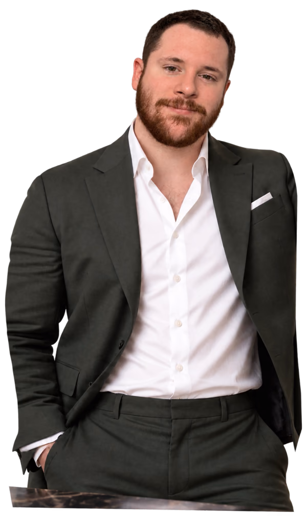 Kailan in a dark green suit